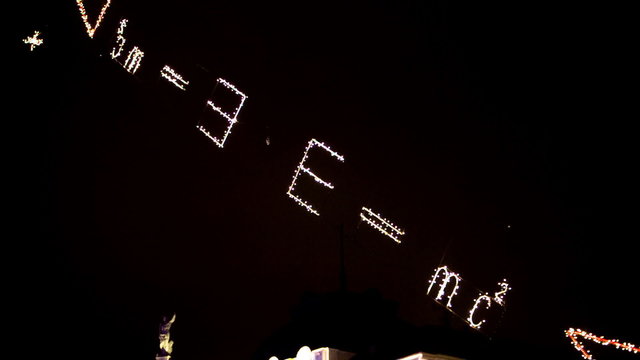 Shiny lights in air with E = mc2 sign