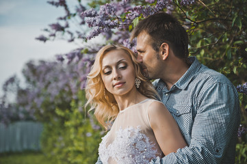 Newly-married couple among lilac bushes 3154.