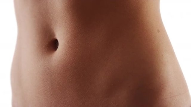 Closeup of healthy fit woman flat stomach