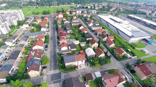 Aerial of resident houses with UWCT bikers passing through