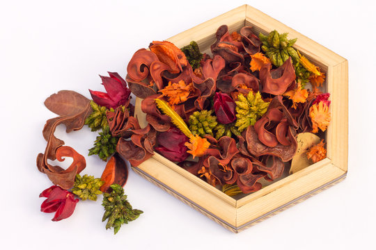 Dried Flowers And Herbs In A Low Wooden Vase