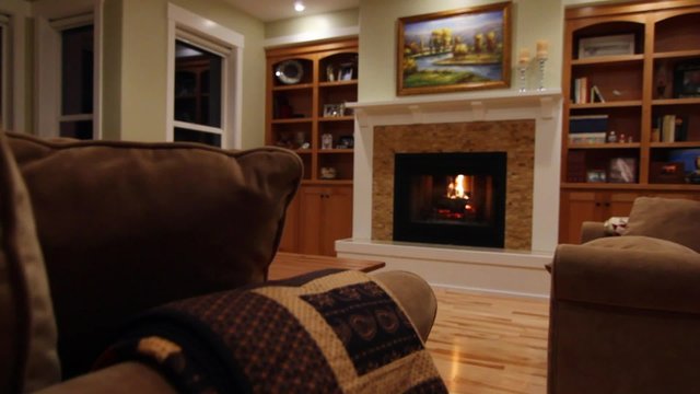 a roaring fireplace in living room jib shot