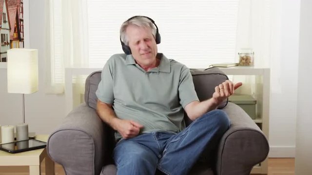 Senior man air guitar