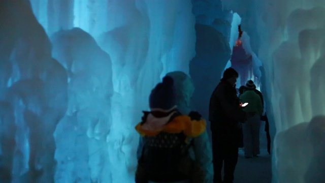 people walking in ice cave
