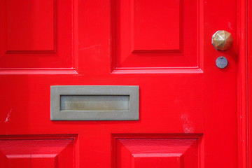 Red door with knob and letter box