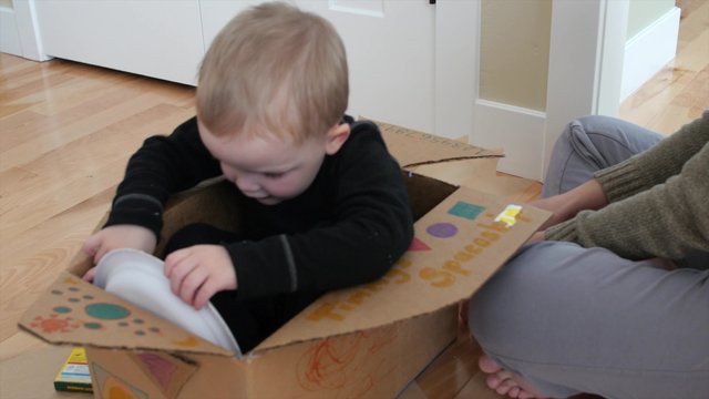 Mom making a spaceship with her toddler