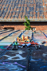 Used graffiti spray cans laying around
