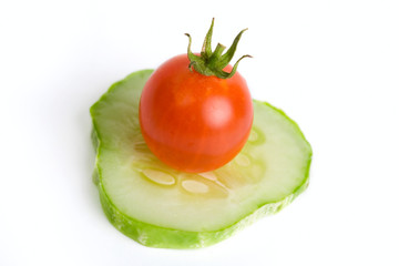 Tomato and Cucumber Canape – A slice of cucumber with a cherry tomato on top.