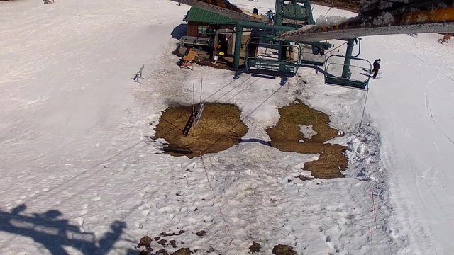 riding the chair lift for spring skiing