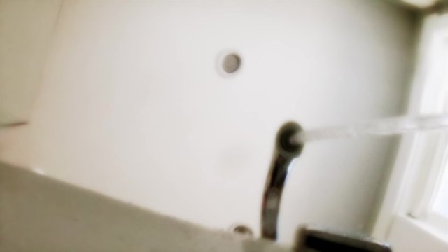 Faucet Filling the Bathtub