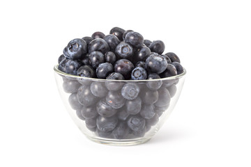 Bowl of fresh ripe organic blueberries on a white background
