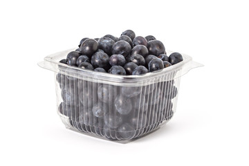 Box or punnet of fresh ripe organic blueberries on a white background