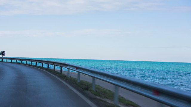 Road beside the blue sea