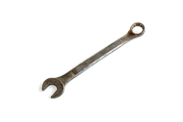 Old rusty wrench isolated on white