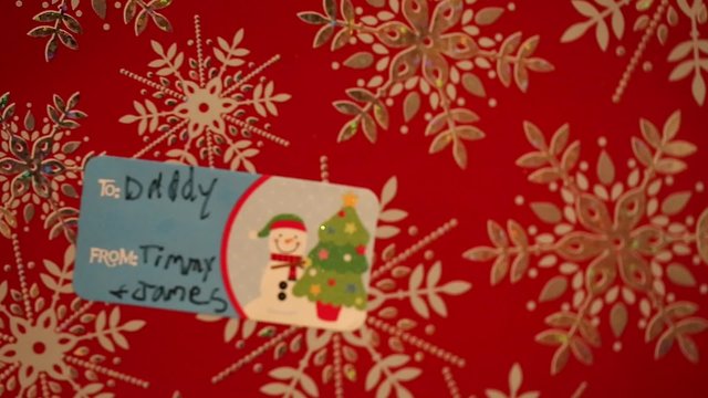a tag says to daddy from timmy