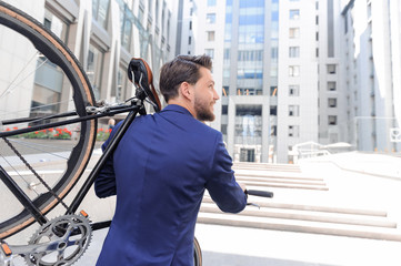 Nice man holding bicycle 