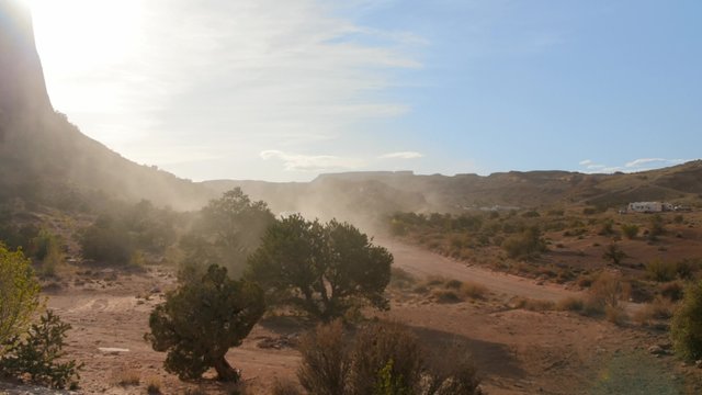Timelapse of cars driving on a desert road