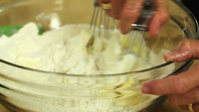 cutting butter into a pie crust