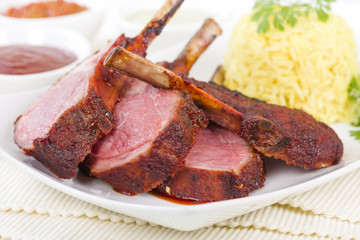 Lamb Cutlets - Spicy roasted lamb cutlets served saffron rice, salad and dips.