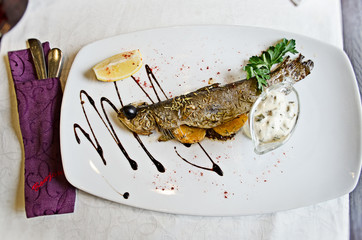 Tasty grilled fish in a French restaurant