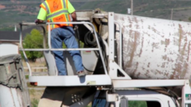 Man Cleaning Out Cement Truck