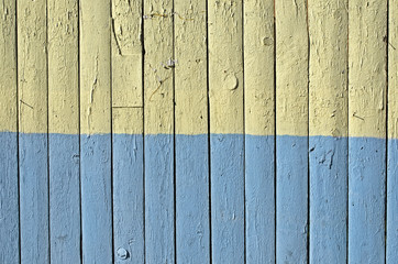 Flag of Ukraine painted on old wooden background