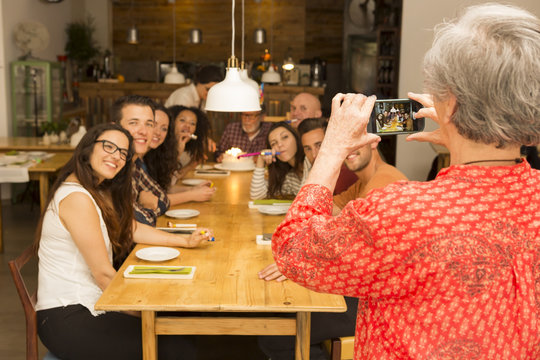 Granny taking a picture of all family