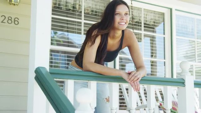 Happy woman leaning on rail