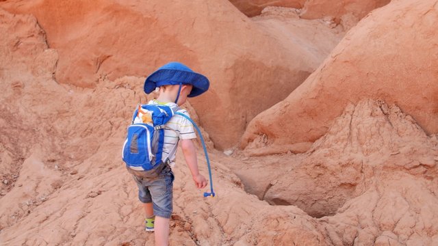 Little kid playing in Goblin Valley State Park