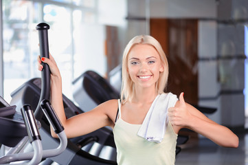 Fototapeta premium Blond girl in a fitness club