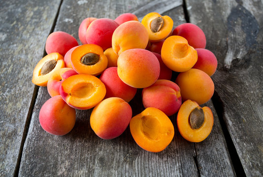 apricots on wooden surface