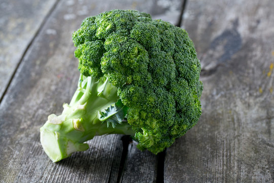 fresh broccoli on wooden table