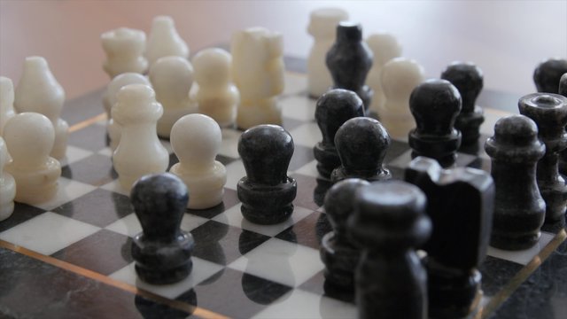Playing chess game on a chess board