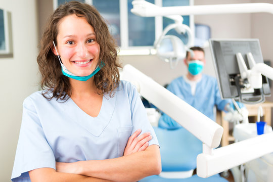 Portrait Of A Young Attractive Dentist In His Office