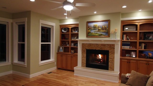 roaring fireplace in a living room jib shot
