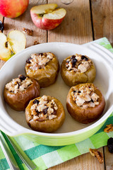 Naklejka na ściany i meble Delicious baked apple filled with minced meat, prunes, onions and walnuts
