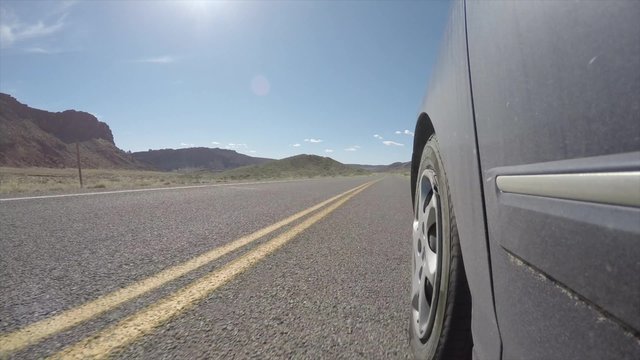 A timelapse exterior shot of driving in Arches National Park