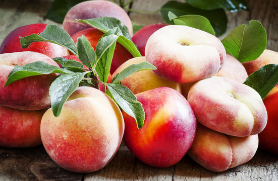 Assortment of peaches: big peaches, nectarines, flat peaches wit