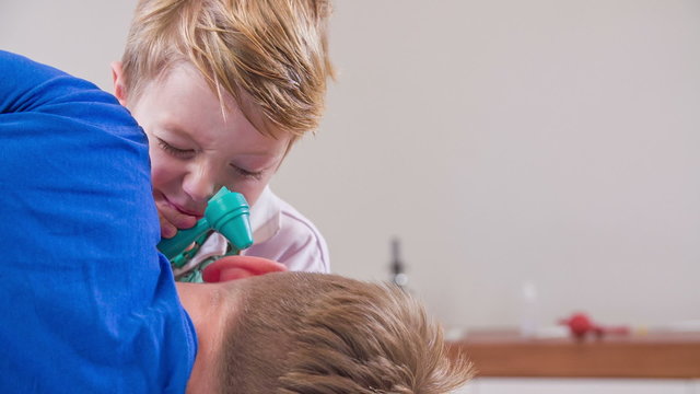 Ear check with otoscope in slow motion