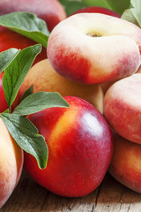 Assortment of peaches: big peaches, nectarines, flat peaches wit
