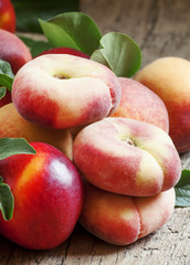 Assortment of peaches: big peaches, nectarines, flat peaches wit