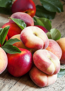 Assortment of peaches: big peaches, nectarines, flat peaches wit