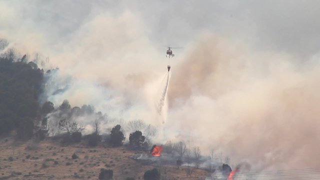 Helicopter Trying To Put Out Wild Fire