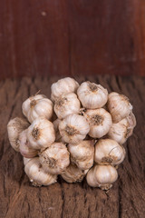 bunch of garlic on wooden table