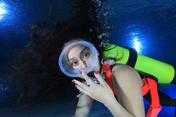 Female scuba diver with neoprene swimsuit 