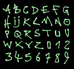 liquid font and number green neon alphabet over black