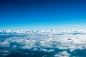 View of white clouds from plane - obrazy, fototapety, plakaty