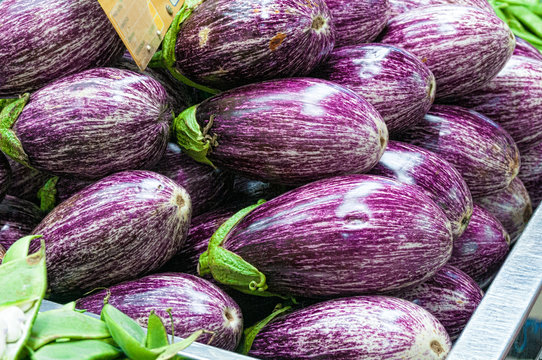 Ripe eggplants on stall