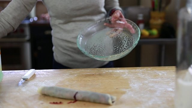 a woman baking a tasty berry pie pastry