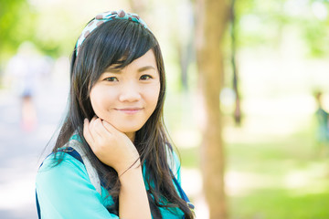 Young woman smiling look at camera outdoors